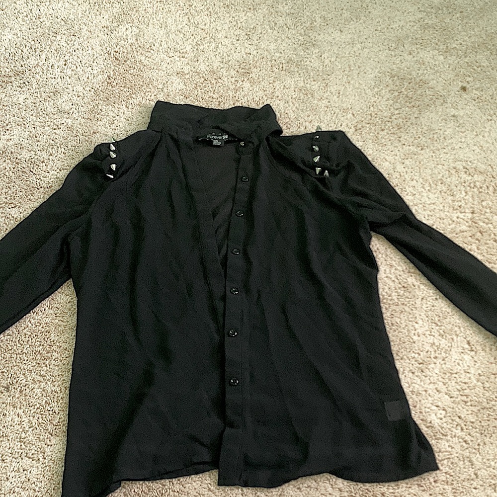 Black blouse with shoulder spikes